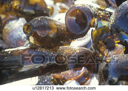 Empty bottles in a pile waiting for recycling View Large Photo Image Stock Image - Empty bottles in a pile waiting for recycling. Fotosearch