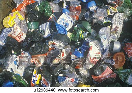 Stock Image - Plastic bottles crushed and ready for processing at a recycling center in USA. Fotosearch