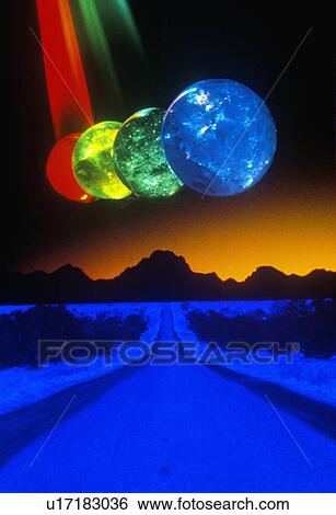 A blue and black horizon below several multi-colored spheres appearing as planets with laser lights shining through View Large Photo Image Stock Photograph - A blue and black horizon below several multi-colored spheres appearing as planets with laser lights shining through. Fotosearch