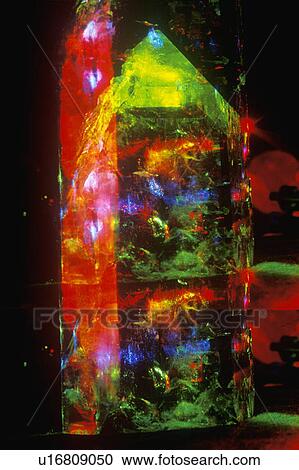 A glowing crystal rock formation illuminated by multicolored laser light View Large Photo Image Stock Image - A glowing crystal rock formation illuminated by multicolored laser light. Fotosearch