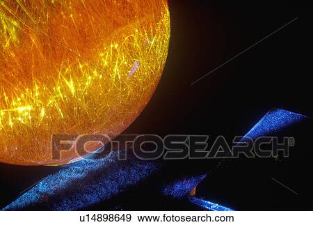 A glowing crystal sphere as orange laser light shines through View Large Photo Image Stock Photo - A glowing crystal sphere as orange laser light shines through. Fotosearch
