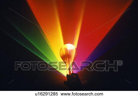 A lightbulb illuminated with an array of rainbow colors from a laser View Large Photo Image Stock Photography - A lightbulb illuminated with an array of rainbow colors from a laser. Fotosearch