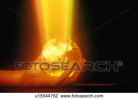 Hands holding a glowing crystal sphere as orange laser light shines down View Large Photo Image Stock Image - Hands holding a glowing crystal sphere as orange laser light shines down. Fotosearch