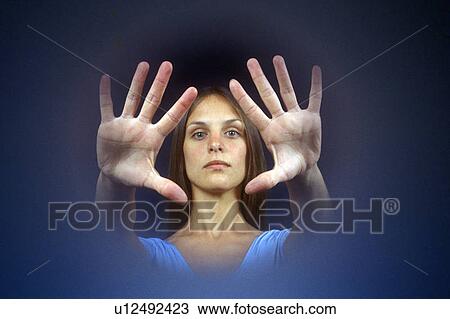 Stock Image - Vignette of a woman's head and hands held out before her. Fotosearch