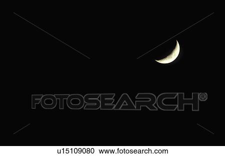 A crescent moon against a black starless sky View Large Photo Image Stock Image - A crescent moon against a black starless sky. Fotosearch