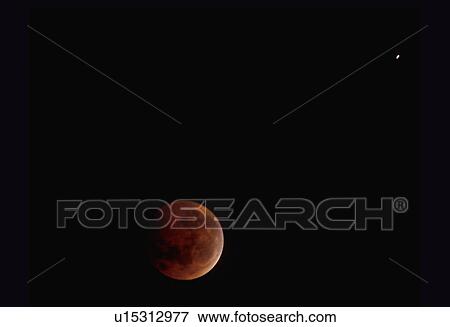 A full moon mostly covered by Earth's shadow during a lunar eclipse against a black starless sky View Large Photo Image Stock Photo - A full moon mostly covered by Earth's shadow during a lunar eclipse against a black starless sky. Fotosearch