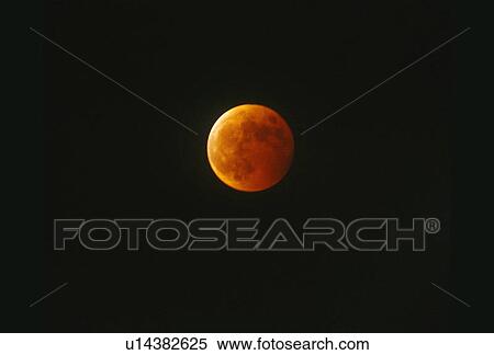 A full moon mostly covered by Earth's shadow during a lunar eclipse against a black starless sky View Large Photo Image Stock Photography - A full moon mostly covered by Earth's shadow during a lunar eclipse against a black starless sky. Fotosearch