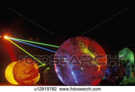 Several multi-colored spheres appearing as planets with laser lights shining through View Large Photo Image Stock Image - Several multi-colored spheres appearing as planets with laser lights shining through. Fotosearch