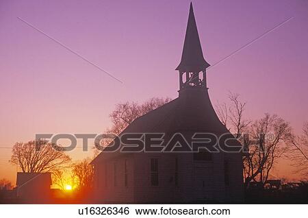 Stock Photograph - A church at sunset. Fotosearch