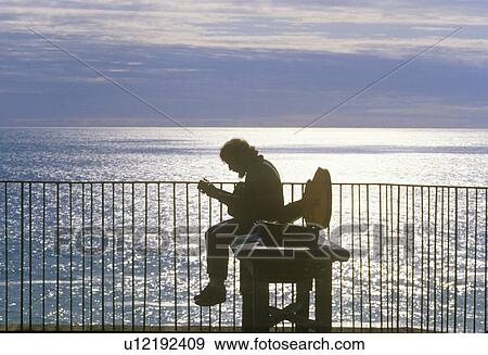 Stock Photo - A singing guitarist. Fotosearch