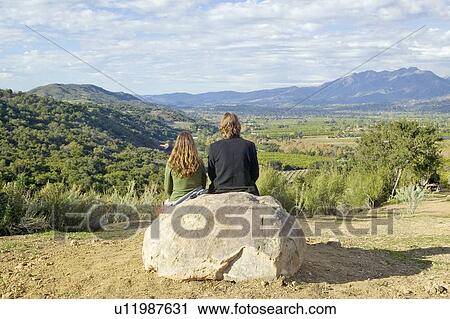 Stock Image - Couple sits and meditates at Meditation Mount's Point. Fotosearch