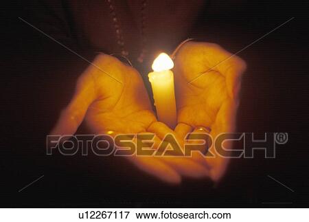 Stock Photo - Hands Holding Candle. Fotosearch