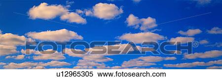Stock Photography - White Clouds in Blue Sky. Fotosearch