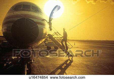 Picture - A passenger boarding an airport. Fotosearch