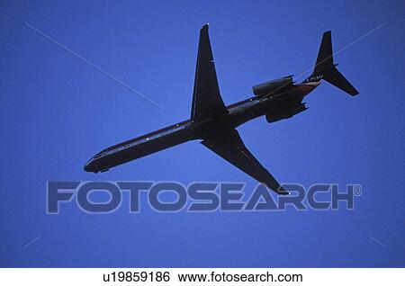 Airplane flying in the sky View Large Photo Image Stock Photograph - Airplane flying in the sky. Fotosearch