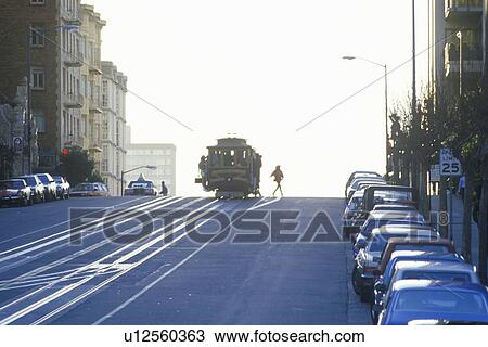 Stock Image - Cable cars at sunset. Fotosearch