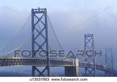Fog enshrouded San Francisco and Bay Bridge View Large Photo Image Stock Image - Fog enshrouded San Francisco and Bay Bridge. Fotosearch
