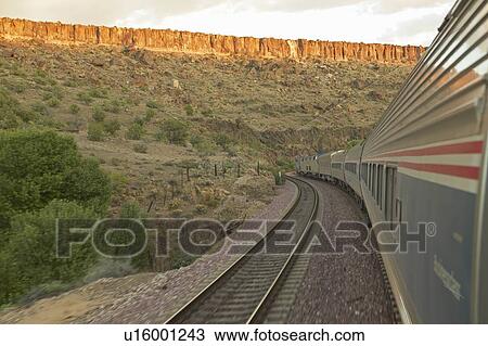 Train moving through landscape View Large Photo Image Stock Image - Train moving through landscape. Fotosearch