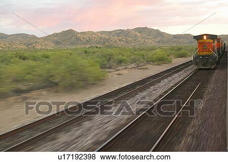 Train moving through landscape View Large Photo Image Stock Photo - Train moving through landscape. Fotosearch