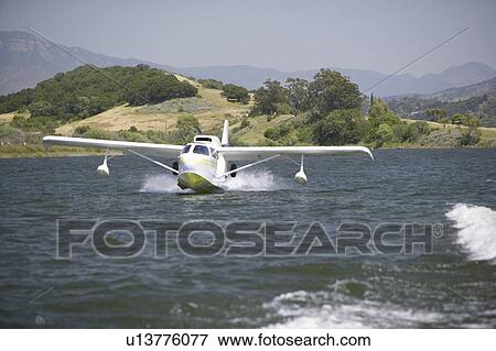 Amphibious seaplane landing on Lake View Large Photo Image Stock Photo - Amphibious seaplane landing on Lake. Fotosearch