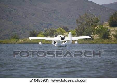 Amphibious seaplane landing View Large Photo Image Stock Image - Amphibious seaplane landing. Fotosearch