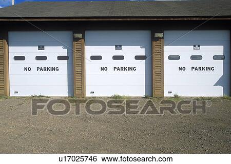 No Parking signs on a garage door View Large Photo Image Stock Photograph - No Parking signs on a garage door. Fotosearch