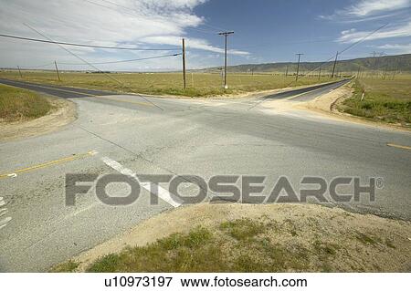 Stock Photo - A four way intersection. Fotosearch