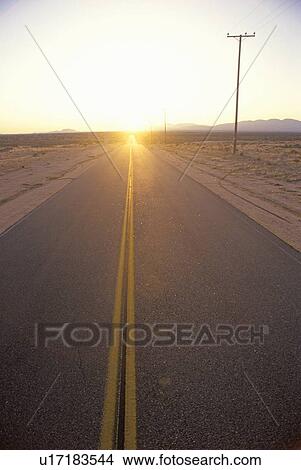 A highway during sunset View Large Photo Image Picture - A highway during sunset. Fotosearch