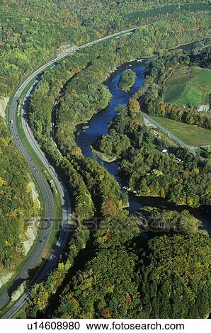 Aerial view of road winding through the woods View Large Photo Image Stock Image - Aerial view of road winding through the woods. Fotosearch
