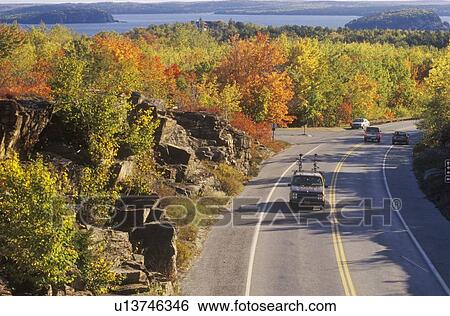 Cars traveling through mountain pass View Large Photo Image Stock Photograph - Cars traveling through mountain pass. Fotosearch