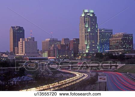 Stock Image - Skyline of Raleigh, NC at night. Fotosearch