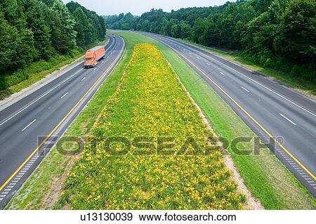 Truck driving on state highway View Large Photo Image Stock Photo - Truck driving on state highway. Fotosearch