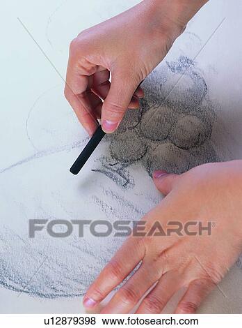 Stock Photo - pen, stationary, charcoal, pencil, hand. Fotosearch