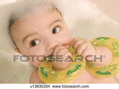 High angle view of a baby girl in a bathtub View Large Photo Image Picture - High angle view of a baby girl in a bathtub. Fotosearch
