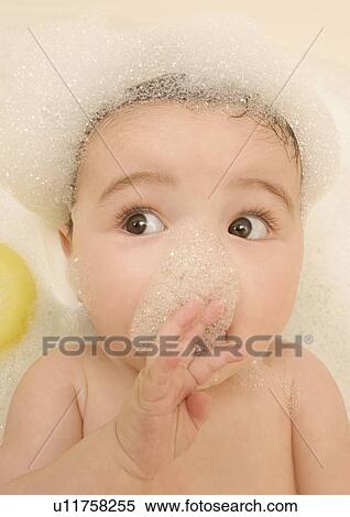 High angle view of a baby girl in a bathtub View Large Photo Image Stock Photography - High angle view of a baby girl in a bathtub. Fotosearch
