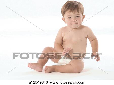 Portrait of a baby boy wearing a diaper View Large Photo Image Stock Photograph - Portrait of a baby boy wearing a diaper. Fotosearch