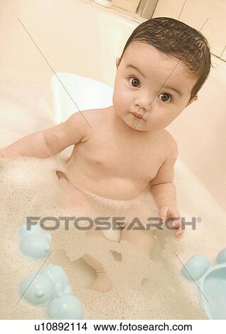 Portrait of a baby girl in a bathtub View Large Photo Image Picture - Portrait of a baby girl in a bathtub. Fotosearch