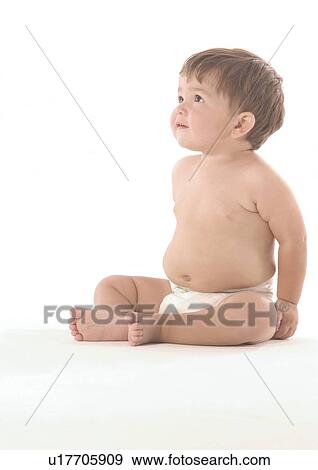 Stock Photo - Side profile of a baby boy looking up. Fotosearch