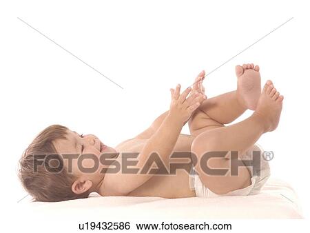 Side profile of a baby boy lying on his back View Large Photo Image Stock Photograph - Side profile of a baby boy lying on his back. Fotosearch