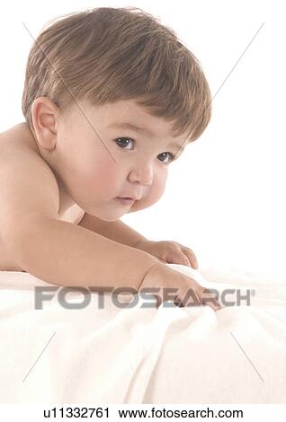 Side profile of a baby boy lying over a pillow View Large Photo Image Stock Image - Side profile of a baby boy lying over a pillow. Fotosearch