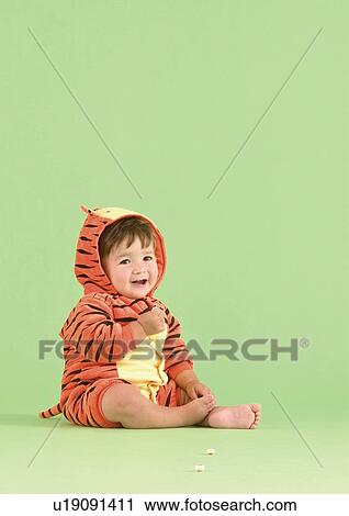Side profile of a baby boy wearing a tiger costume View Large Photo Image Stock Image - Side profile of a baby boy wearing a tiger costume. Fotosearch