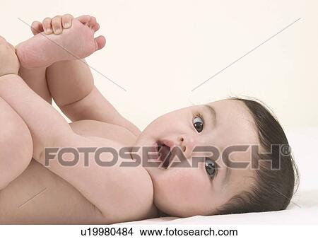 Side profile of a baby girl lying down View Large Photo Image Picture - Side profile of a baby girl lying down. Fotosearch