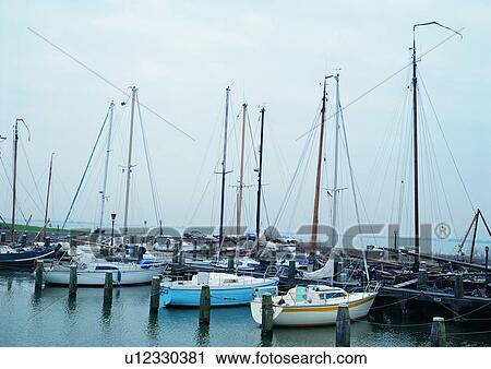 Stock Image - Boat, Day, Dock, Dusk, Harbor. Fotosearch