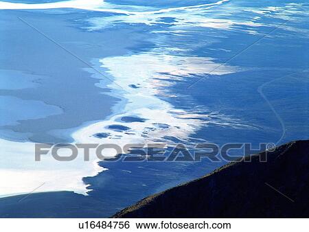 Stock Photograph - Coast, Frozen, Flowing Water, Day, Aerial View. Fotosearch