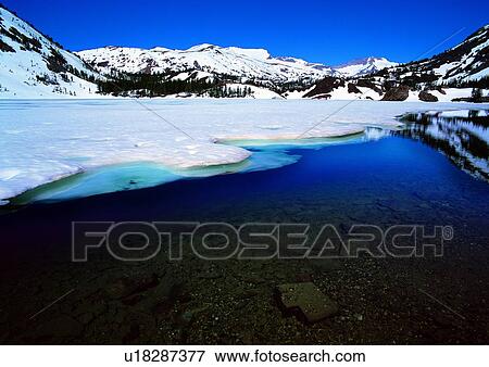 Stock Photo - Snow Covered, Frozen, Mountain, Rocky, Outdoor, Mountain Range, Day. Fotosearch