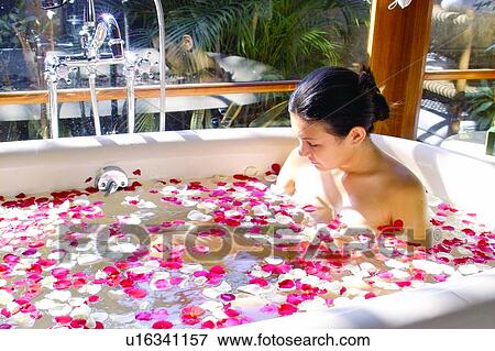Stock Photo - Body Care, Bathtub, One Young Woman Only, Pampering, Petal. Fotosearch