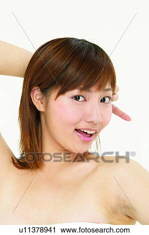 Stock Image - Bangs, Close-Up, Brown Hair, Asian Ethnicity. Fotosearch