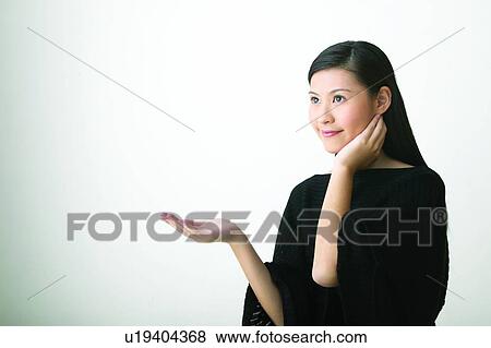 Stock Photo - Black, Close-Up, Casual Clothing, Black Hair, Asian Ethnicity. Fotosearch