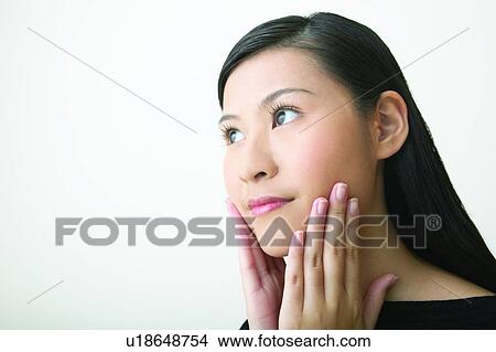 Picture - White Background, Young Adult, Thinking, Hair Part. Fotosearch