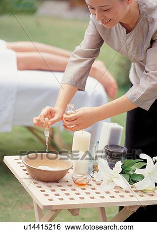 Stock Photograph - asian ethnicity, beautifying, adoring. Fotosearch